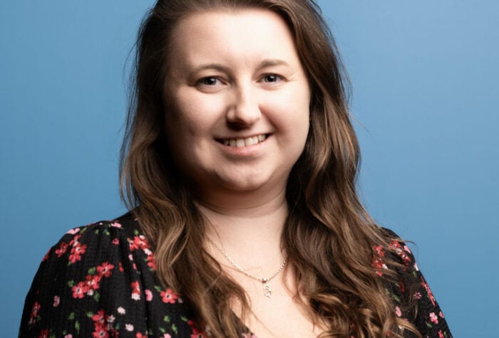 Katherine Peers, in front of a Brookbanks blue background