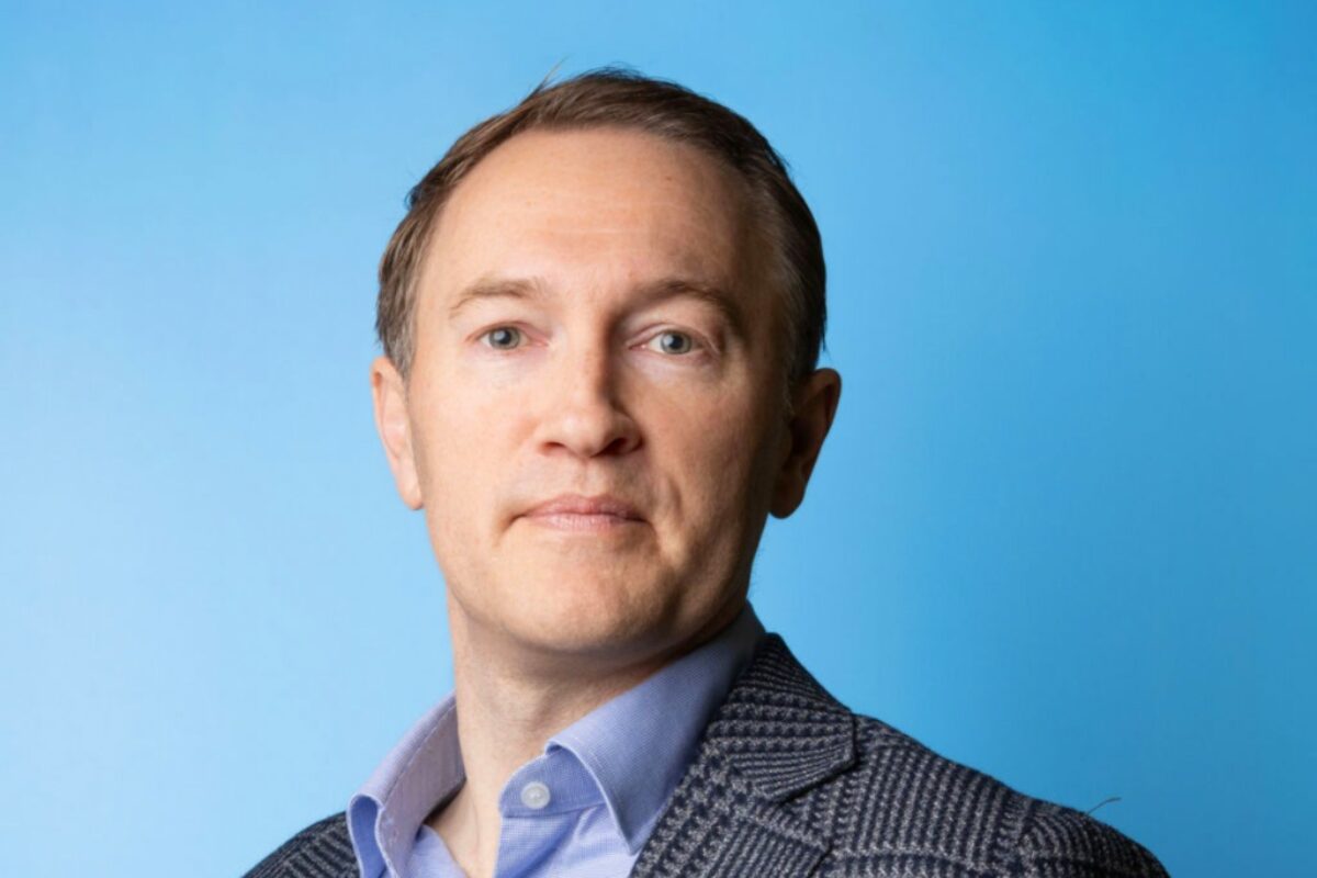 Andrew Thorley Chief Executive of Brookbanks stood in front of a pale blue background