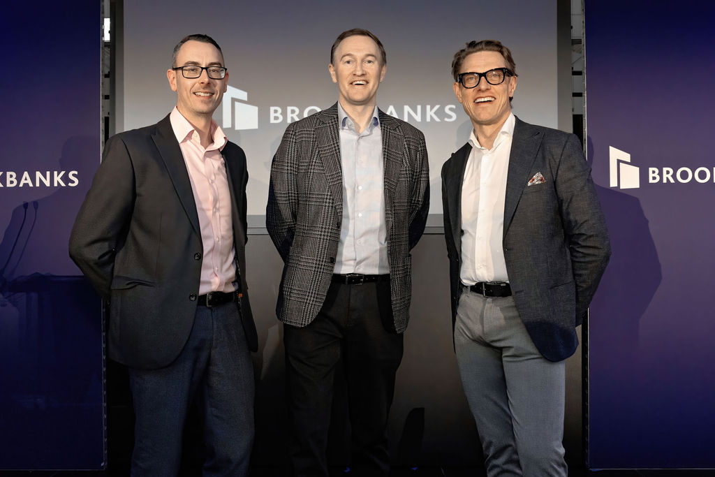 Richard Moorcroft, Andrew Thorley and Paul Boileau of Brookbanks stood in from of a dark blue background with the white Brookbanks logo