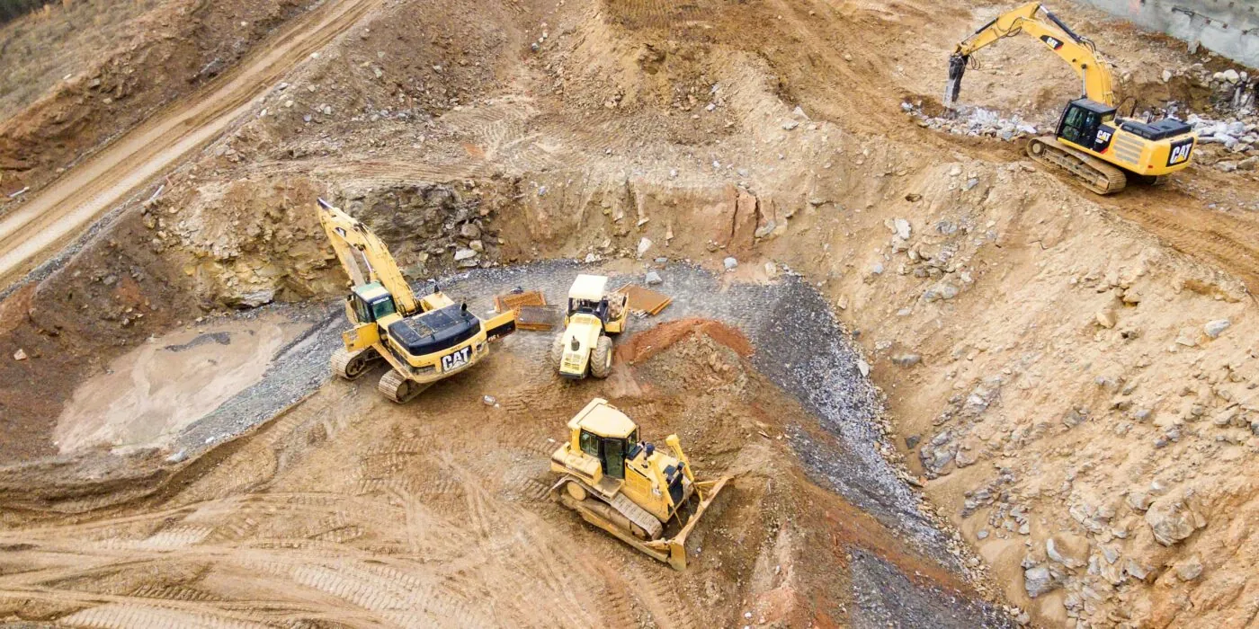 Brookbanks project at pre-build stage with diggers preparing the ground.